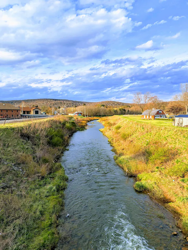 A photo of a stream and clouds.